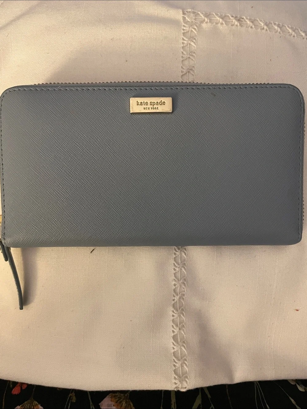 kate spade light blue zip-around wallet with gold plaque